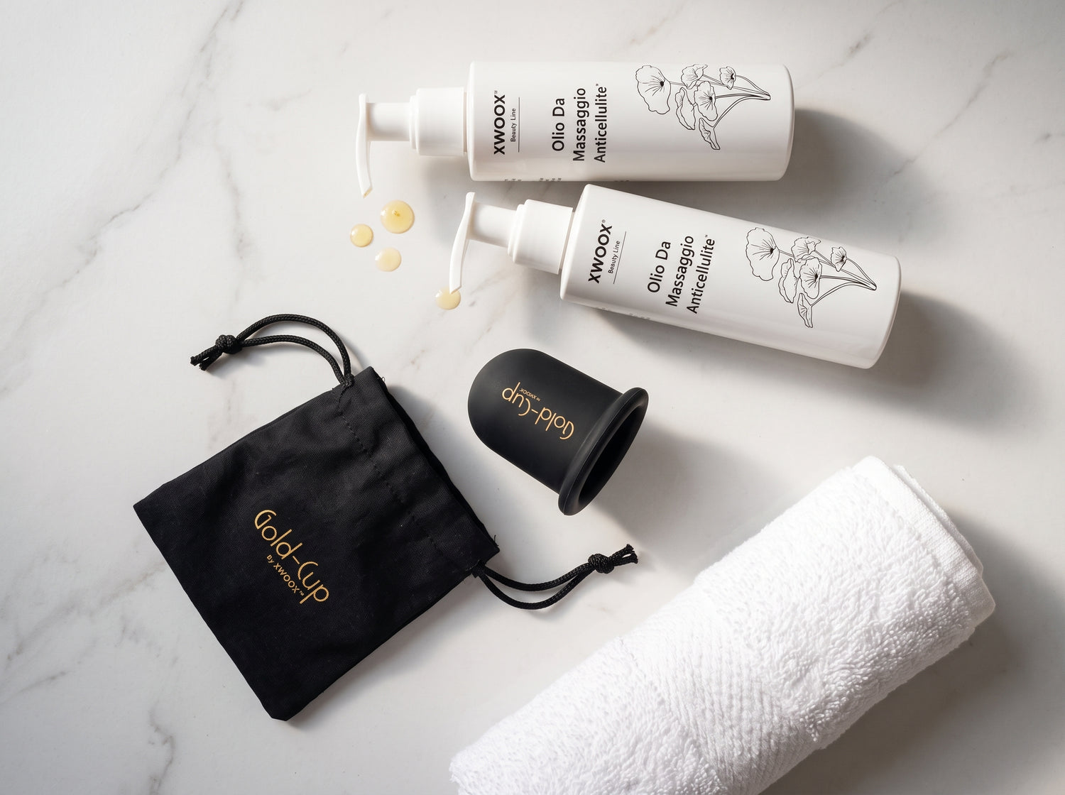 Kit anticellulite XWOOX: due flaconi di Olio da Massaggio, coppetta Gold-Cup e sacchetto pronti per il protocollo combinato